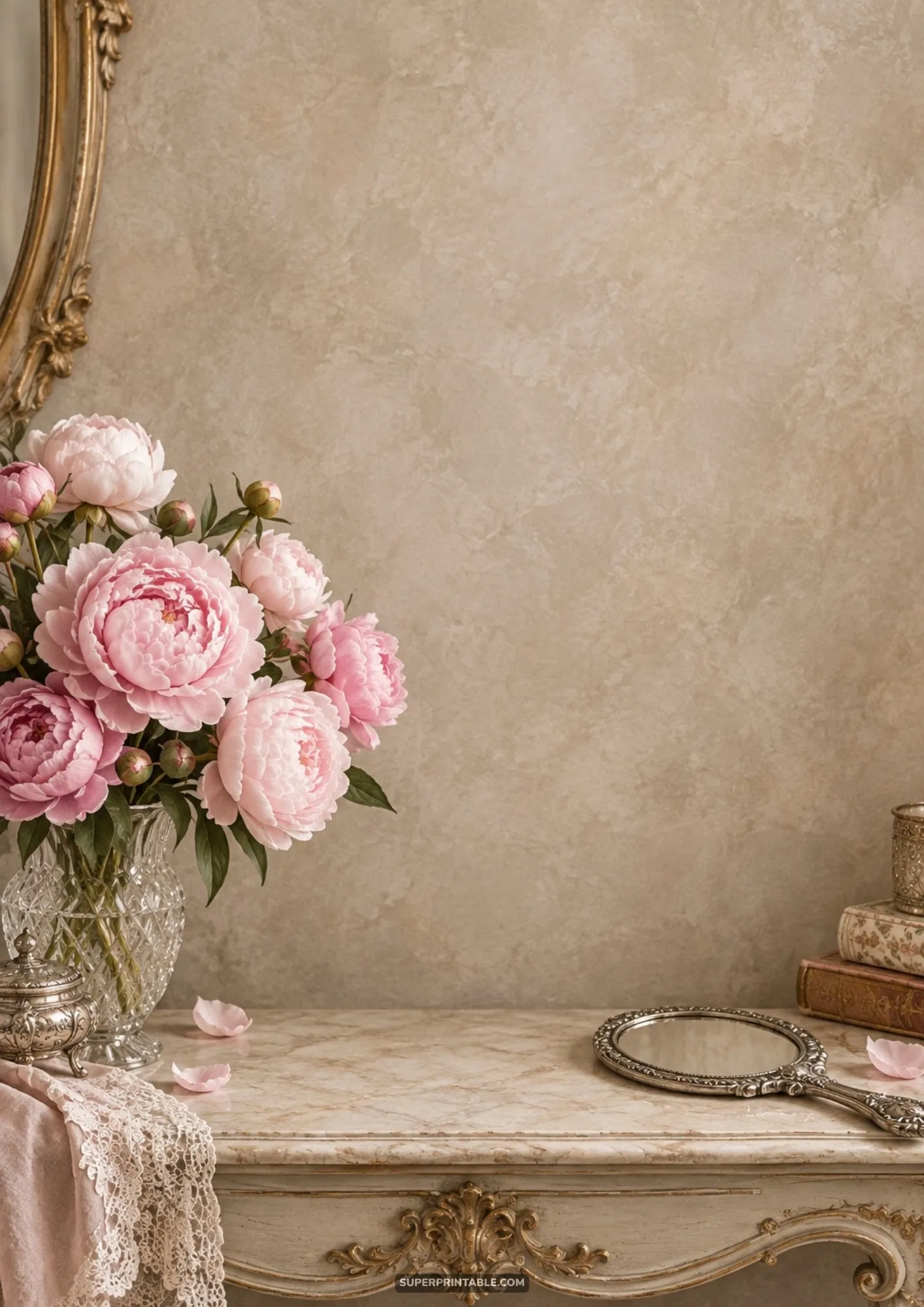 Ornate marble dressing table holding a crystal vase of pink peonies, lace, and a vintage silver mirror