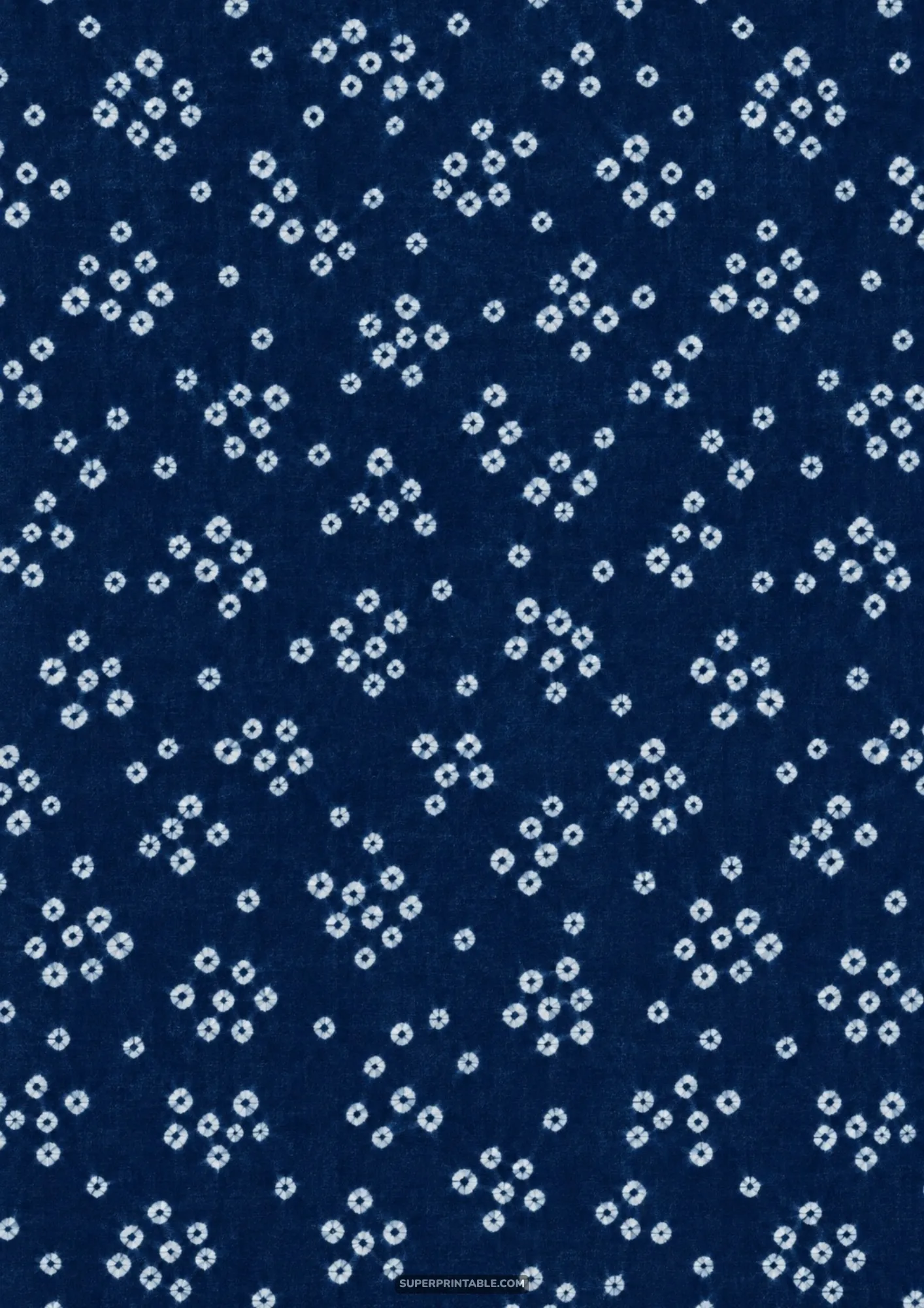 Kanoko shibori speckled diamond dot pattern scattered across deep indigo dyed textile cloth