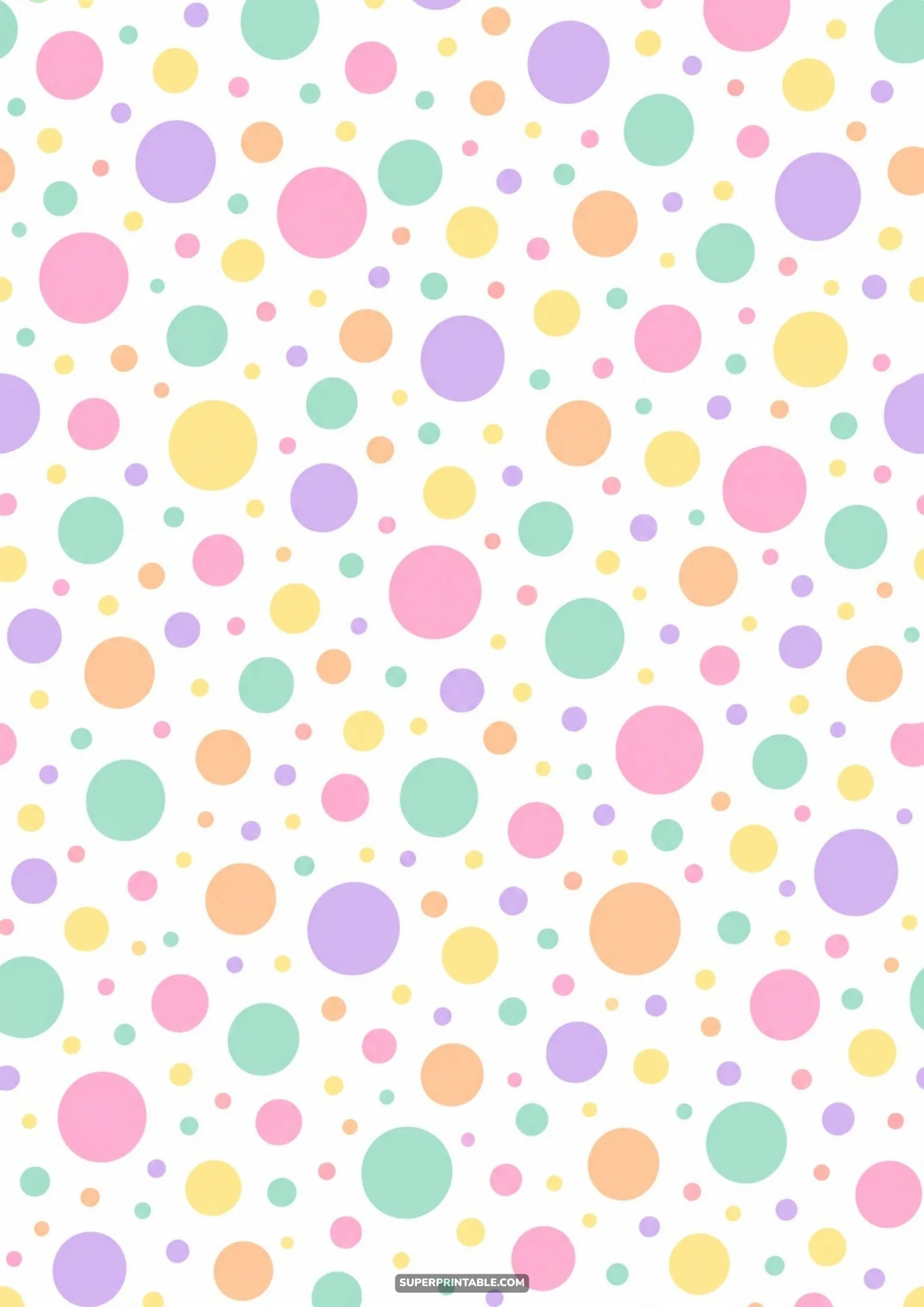Vibrant pastel colored bubbles in varied circular sizes scatter over white paper.